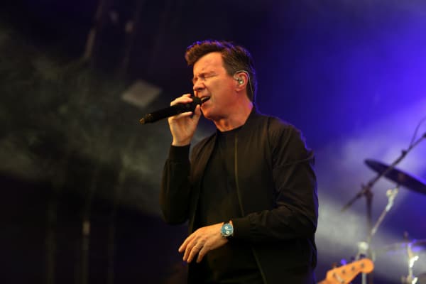 Watch Rick Astley Rock Glastonbury Stage With Blossoms