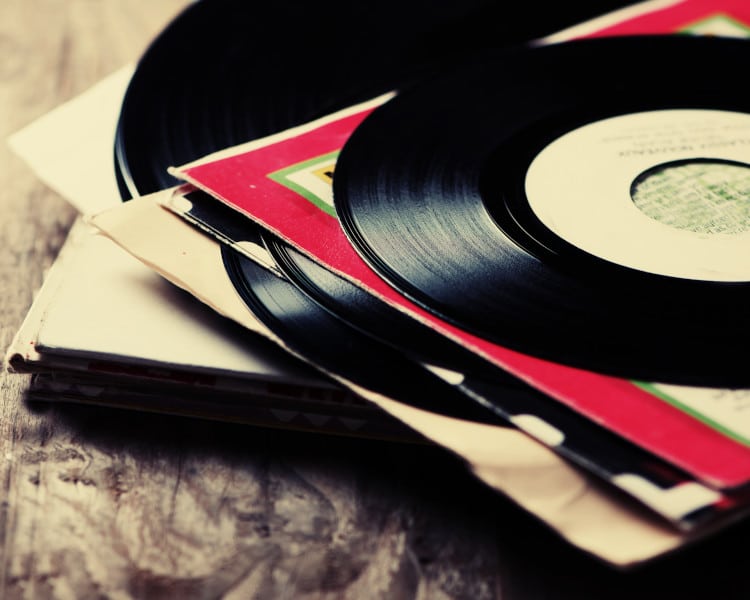 vinyl records on a wooden table